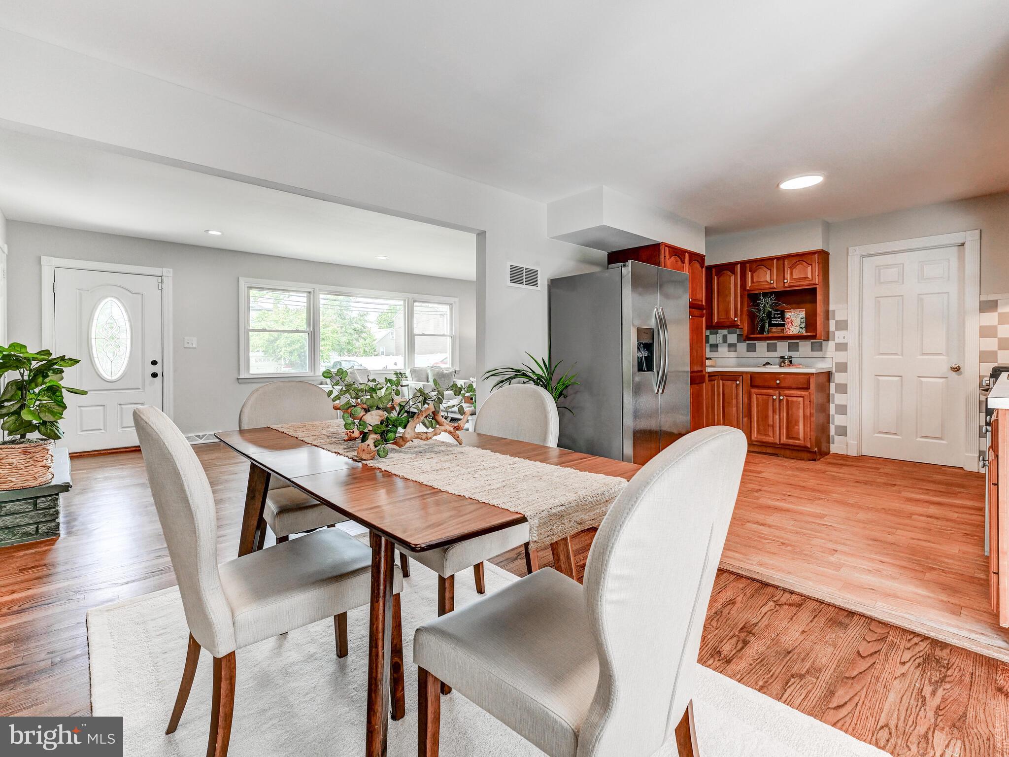 2411 Ruth Avenue Sparrows Point, MD 21219 - Photo 13 of 43 a view of a dining room with furniture and wooden floor