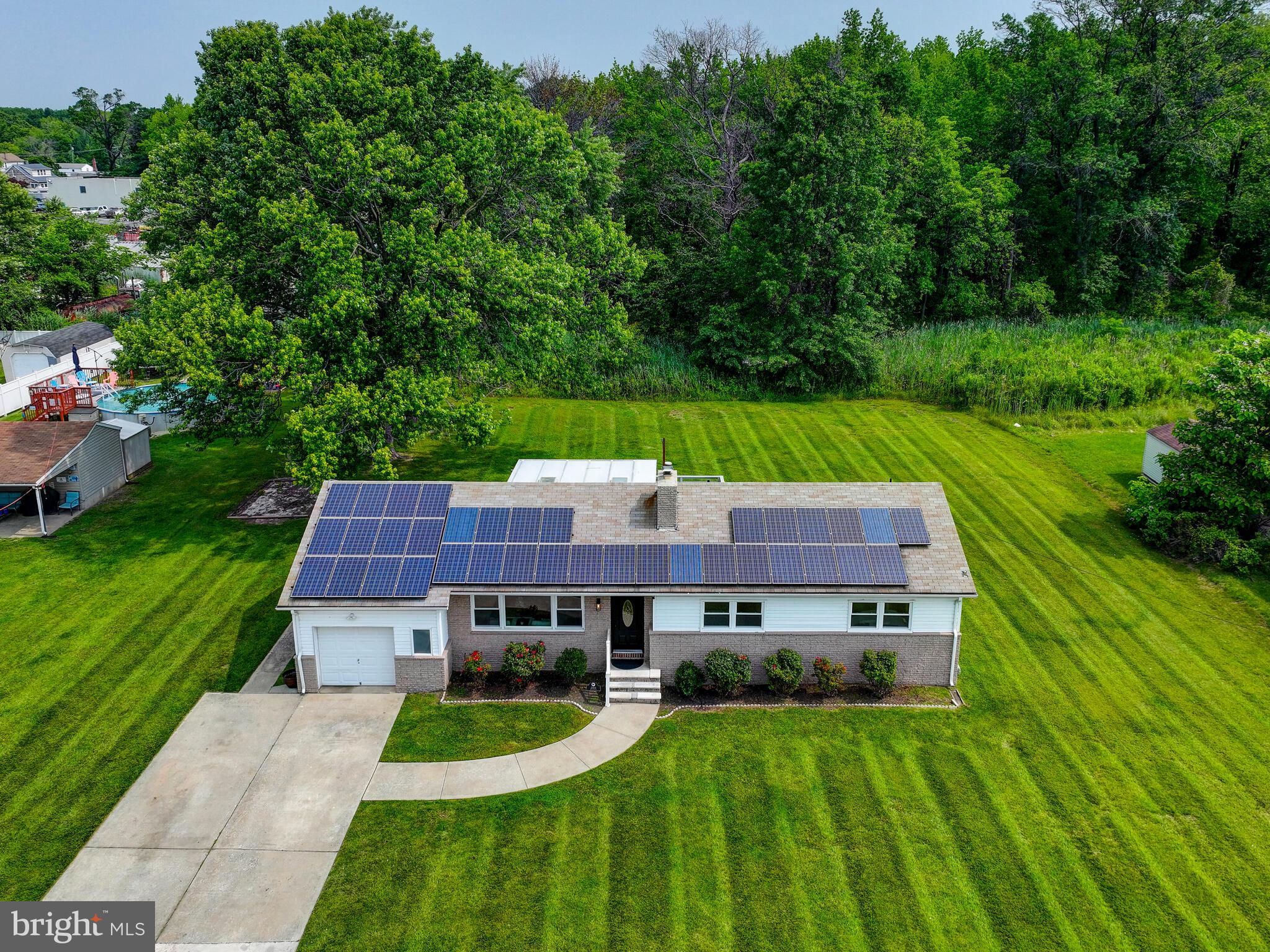 2411 Ruth Avenue Sparrows Point, MD 21219 - Photo 2 of 43 a aerial view of a house next to a big yard and large trees
