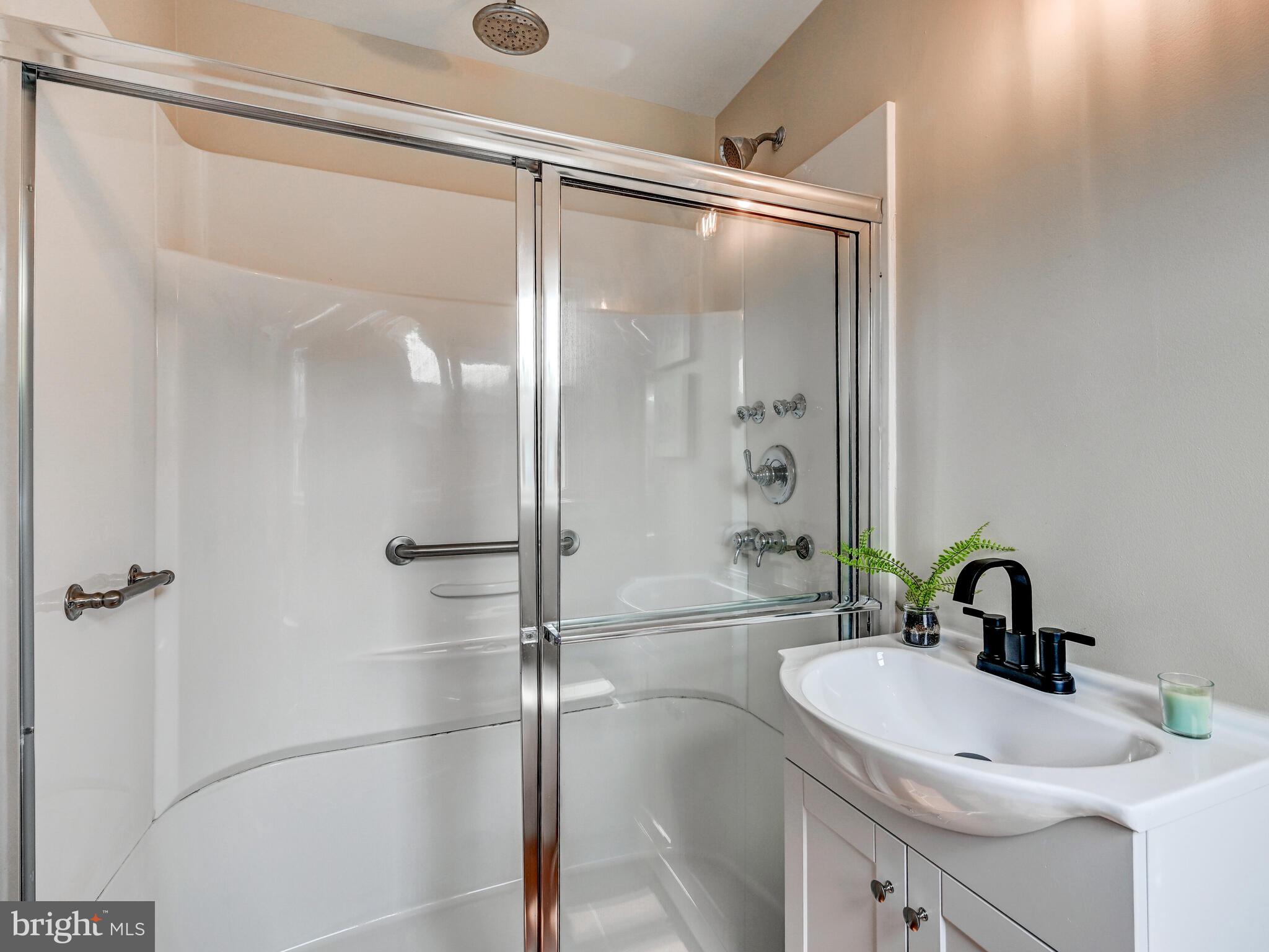 2411 Ruth Avenue Sparrows Point, MD 21219 - Photo 21 of 43 a bathroom with a sink and mirror