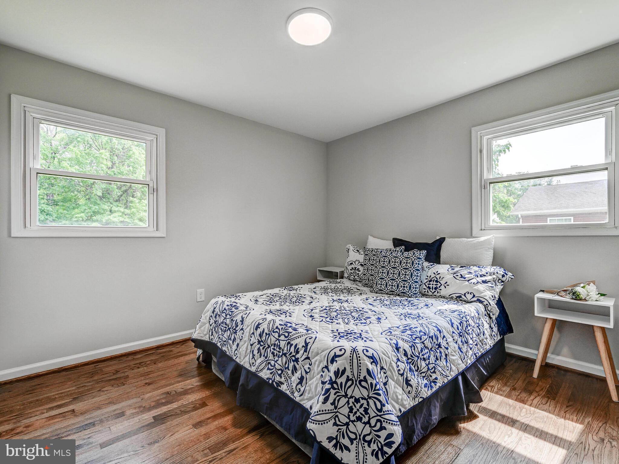 2411 Ruth Avenue Sparrows Point, MD 21219 - Photo 22 of 43 a bedroom with a bed lamp and window