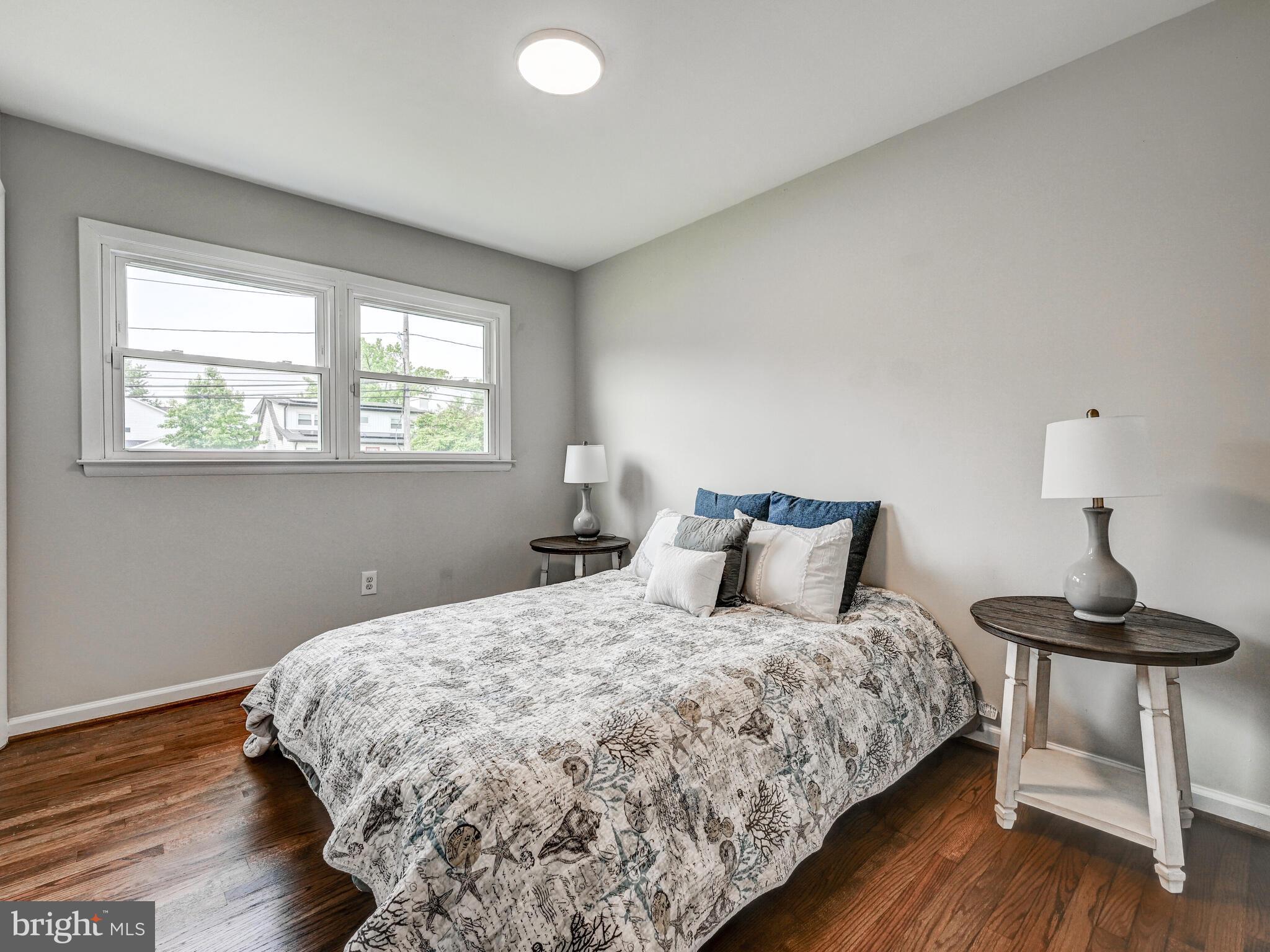 2411 Ruth Avenue Sparrows Point, MD 21219 - Photo 23 of 43 a bedroom with a bed and wooden floor