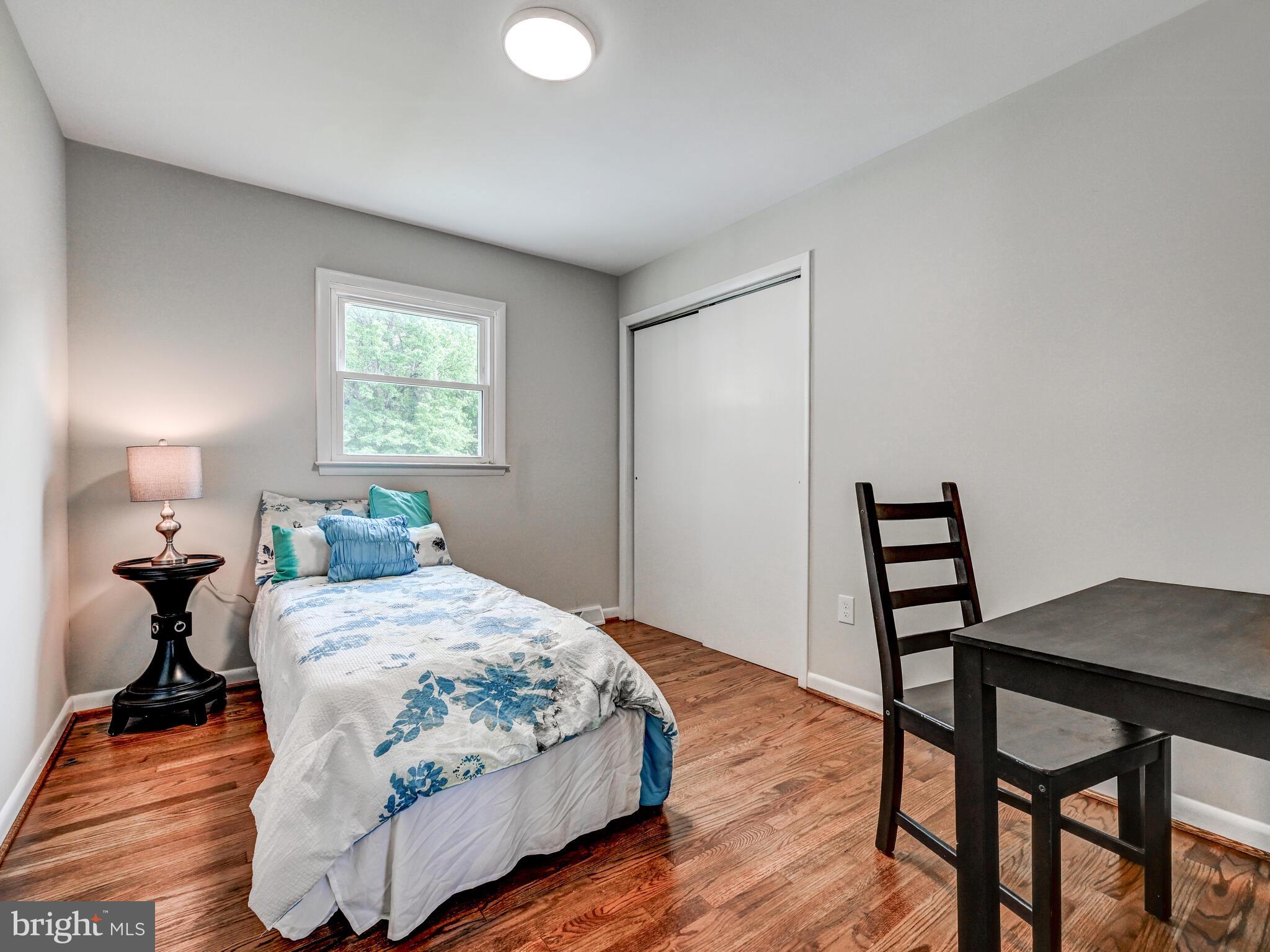 2411 Ruth Avenue Sparrows Point, MD 21219 - Photo 24 of 43 a bedroom with a bed and wooden floor