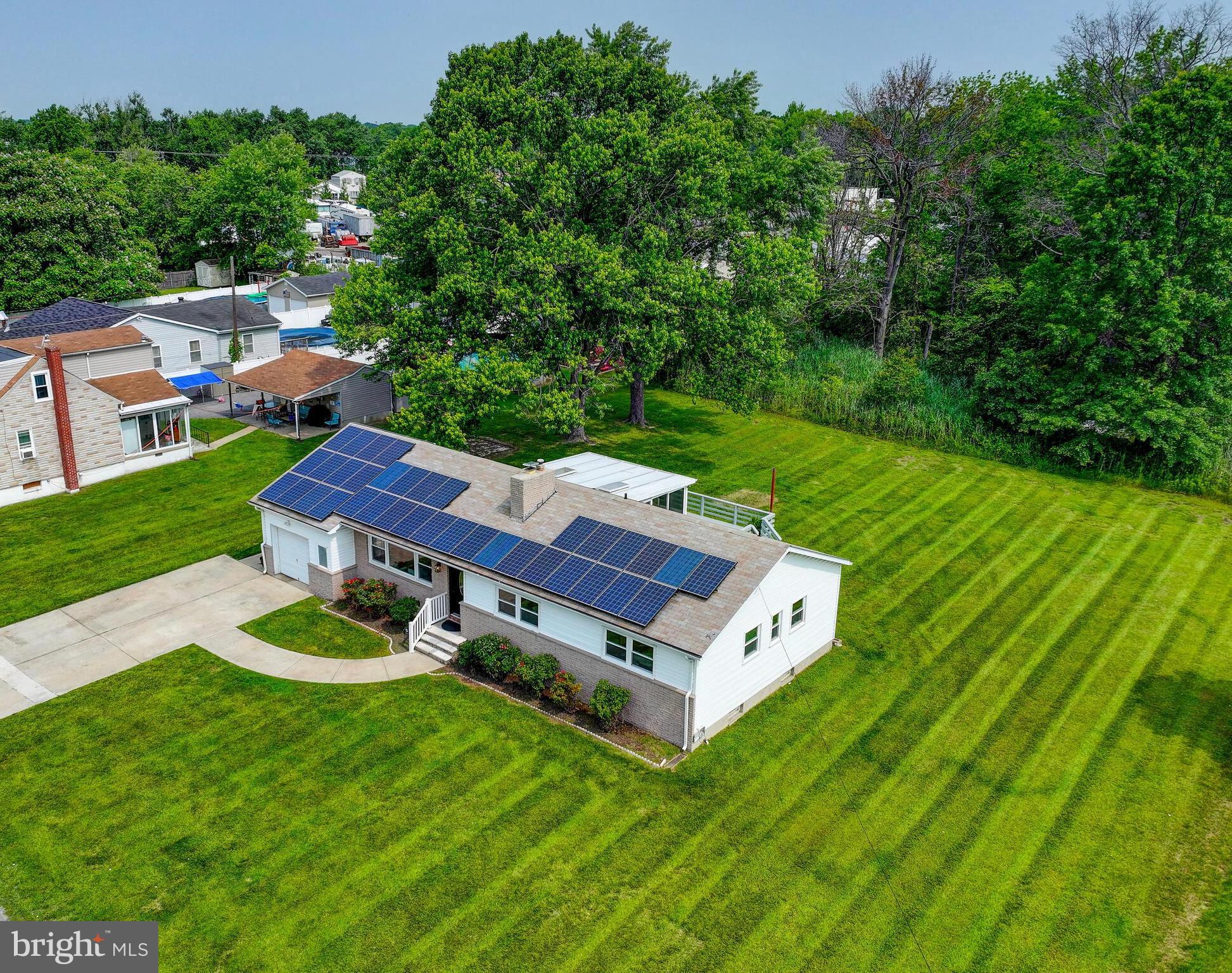 2411 Ruth Avenue Sparrows Point, MD 21219 - Photo 3 of 43 an aerial view of a house with pool big yard and large trees