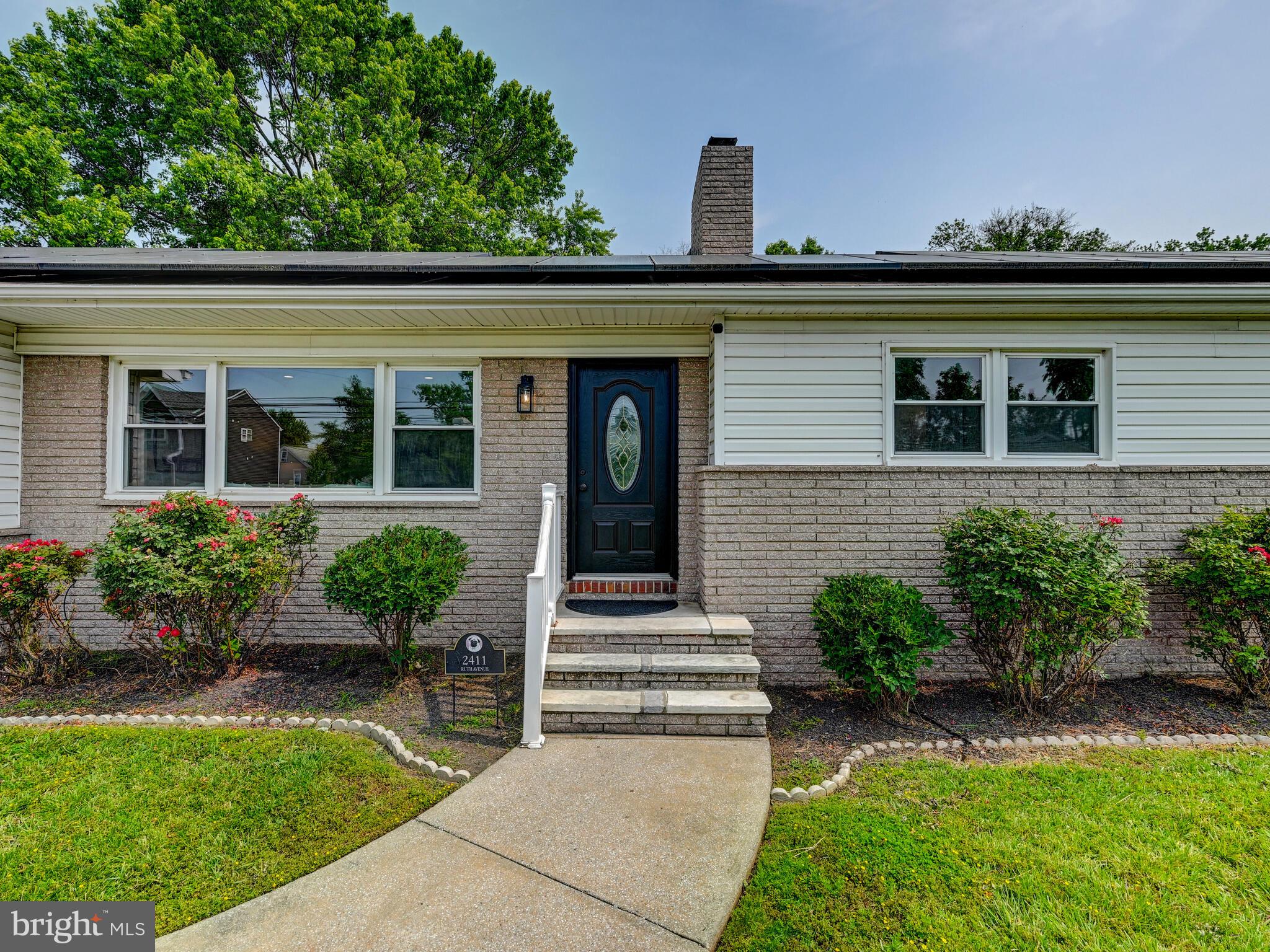 2411 Ruth Avenue Sparrows Point, MD 21219 - Photo 5 of 43 a front view of a house with garden