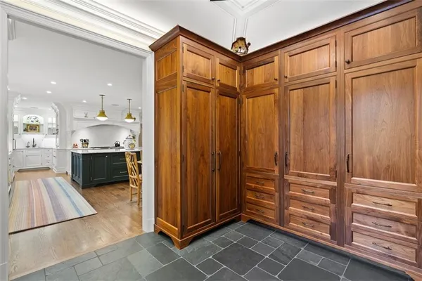 a kitchen with a sink appliances and cabinets