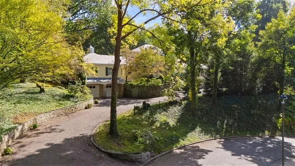 a sign board with yard in front of it