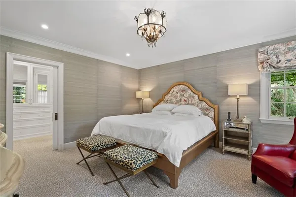 a bedroom with a bed and a couch