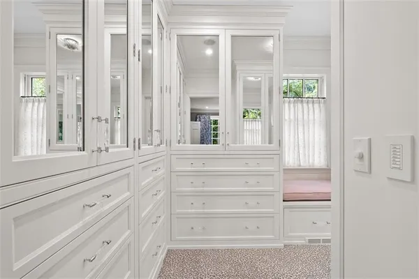 a bathroom with a granite countertop shower and a sink