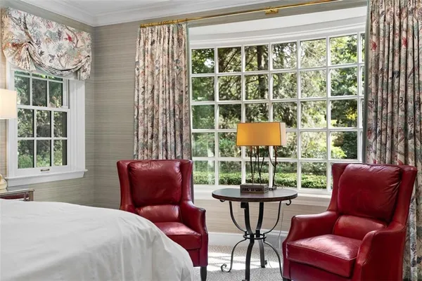 a bedroom with bed and wooden floor