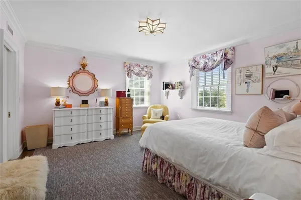 a bedroom with bed and cabinets