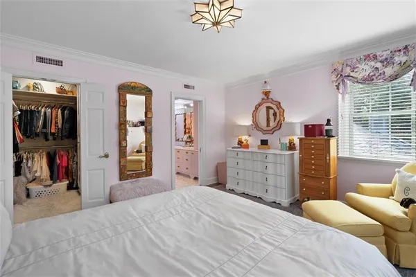 a bathroom with a double vanity sink mirror and shower