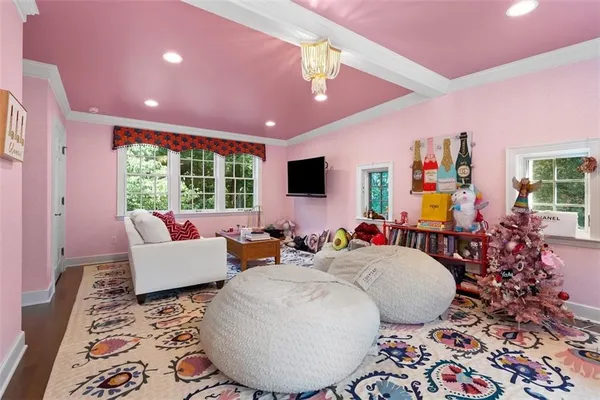 a bed room with furniture and a large window
