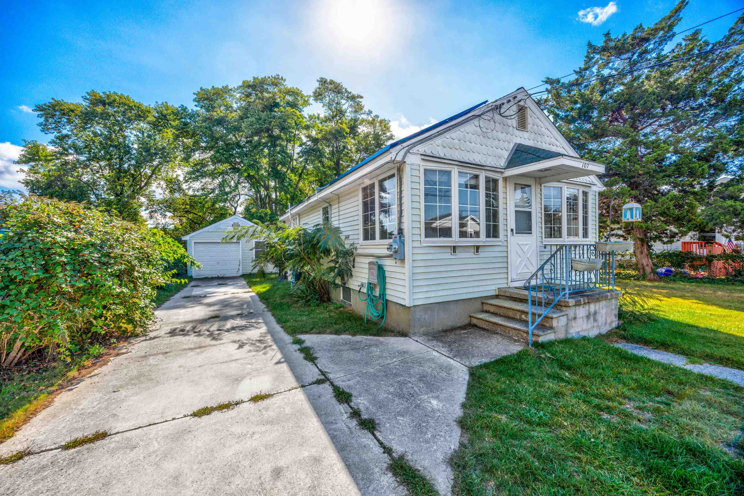 107 Rutledge Avenue Del Haven, NJ 08251 - Photo 1 of 24 a front view of a house with garden