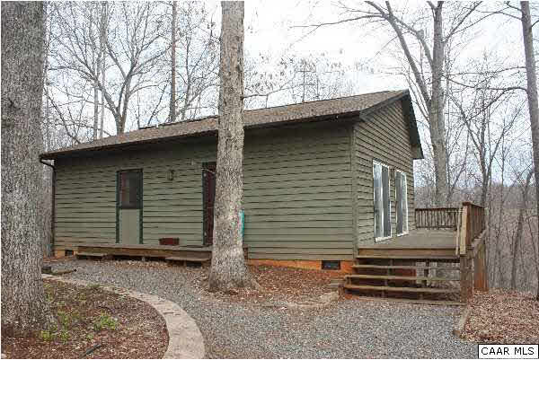 86 Rainbow Ridge Road Faber, VA 22938 - Photo 19 of 30 a backyard of a house with lots of trees