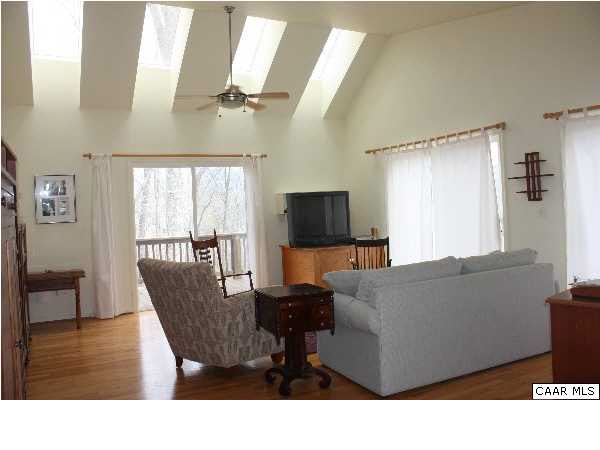 86 Rainbow Ridge Road Faber, VA 22938 - Photo 20 of 30 a living room with furniture and a flat screen tv