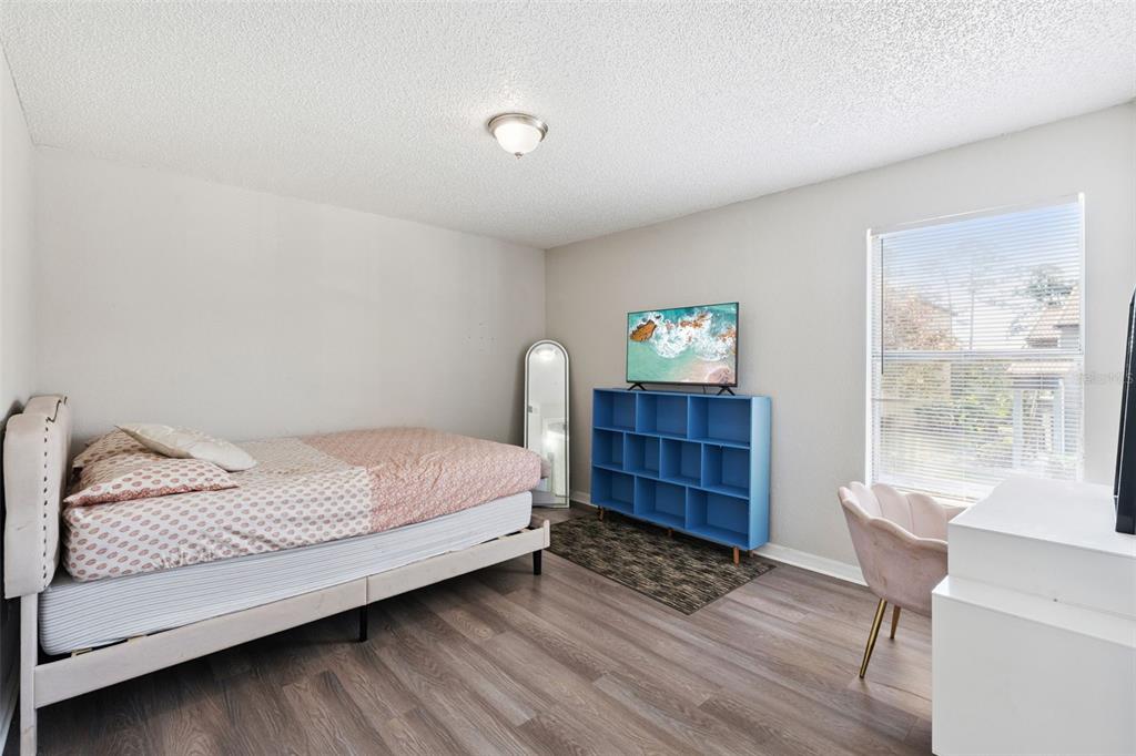 5120 Conroy Road, Unit 28 Orlando, FL 32811 - Photo 12 of 39 a bed room with a bed and a window