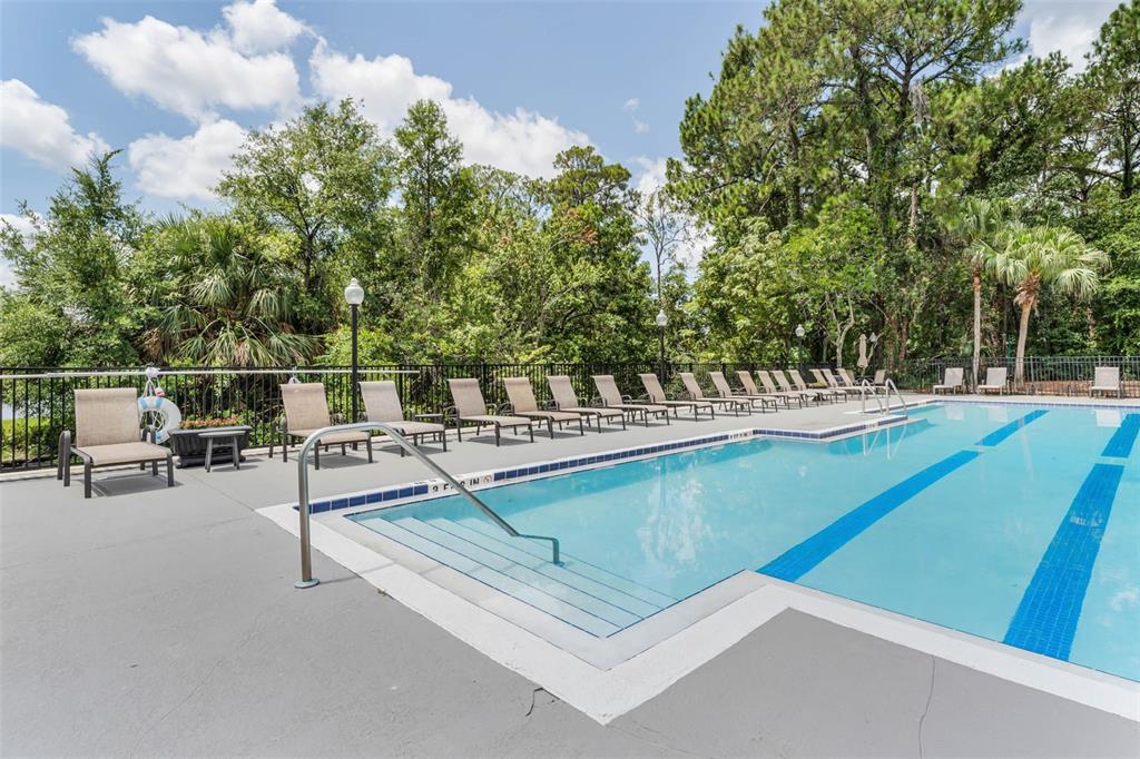 5120 Conroy Road, Unit 28 Orlando, FL 32811 - Photo 26 of 39 a view of a swimming pool with chairs