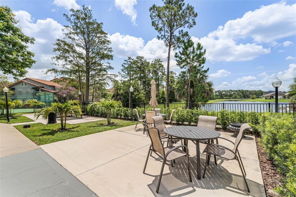 5120 Conroy Road, Unit 28 Orlando, FL 32811 - Photo 31 of 39 a view of a patio with a table and chairs