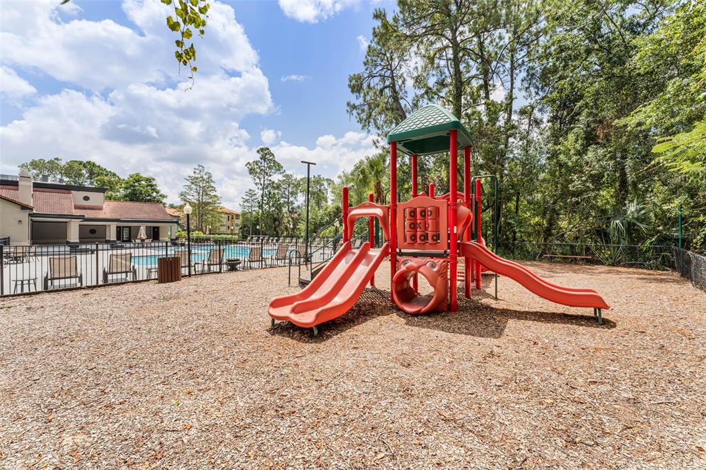 5120 Conroy Road, Unit 28 Orlando, FL 32811 - Photo 34 of 39 a view of outdoor space with playground and green space