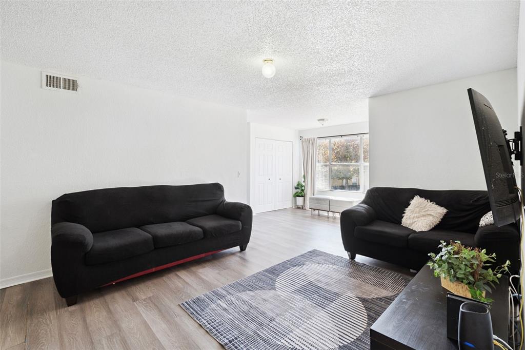 5120 Conroy Road, Unit 28 Orlando, FL 32811 - Photo 4 of 39 a living room with furniture and a window