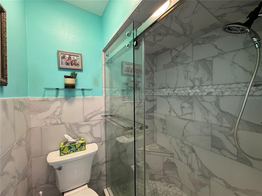 6319 Cocoa Lane Apollo Beach, FL 33572 - Photo 15 of 37 a bathroom with a toilet and a shower
