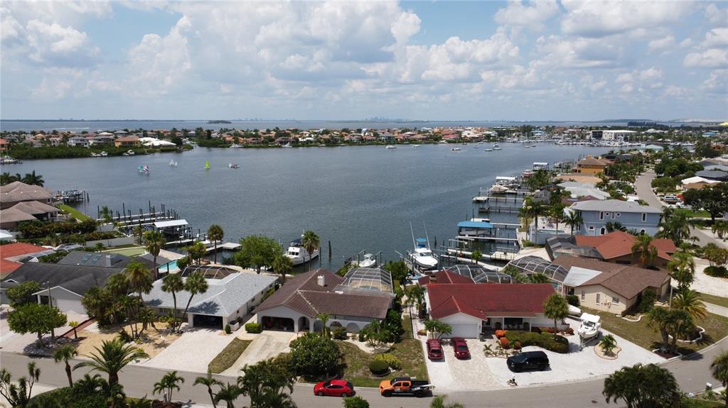 6319 Cocoa Lane Apollo Beach, FL 33572 - Photo 17 of 37 an aerial view of a city with lots of residential buildings and ocean view in back