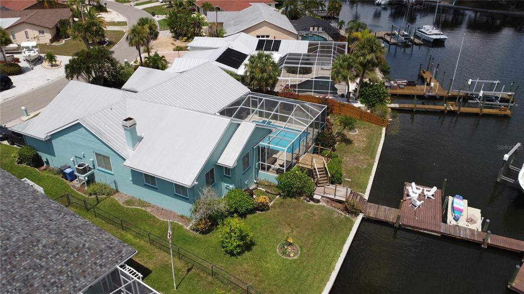 6319 Cocoa Lane Apollo Beach, FL 33572 - Photo 2 of 37 an aerial view of a house with a yard pool a patio and outdoor seating