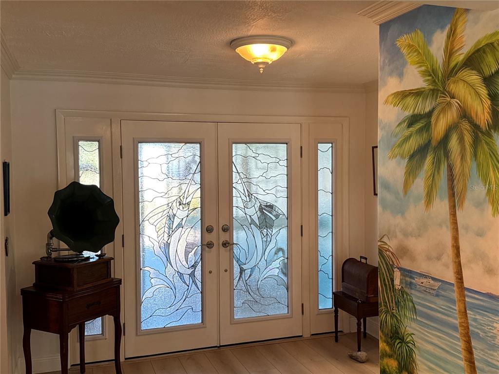 6319 Cocoa Lane Apollo Beach, FL 33572 - Photo 4 of 37 a living room with furniture and a painting on the wall