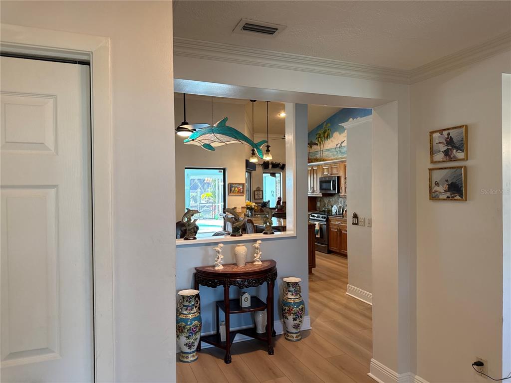6319 Cocoa Lane Apollo Beach, FL 33572 - Photo 5 of 37 a view of a dining room with furniture and wooden floor
