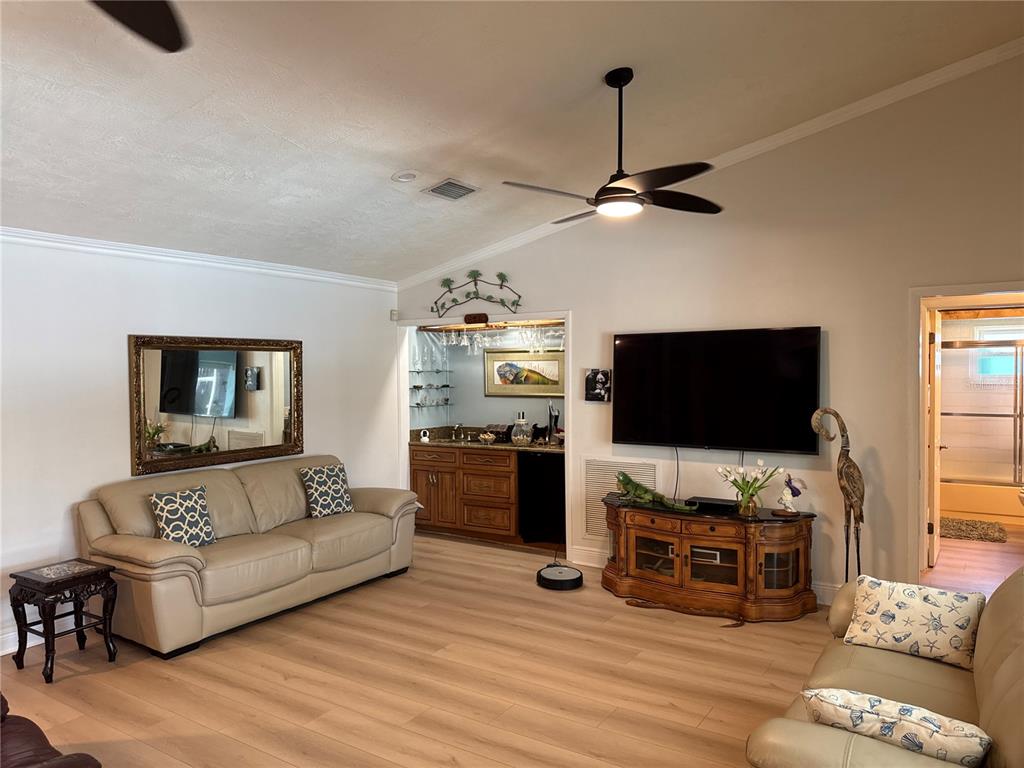 6319 Cocoa Lane Apollo Beach, FL 33572 - Photo 6 of 37 a living room with furniture and a flat screen tv