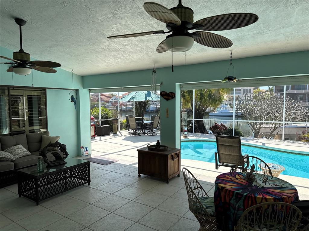 6319 Cocoa Lane Apollo Beach, FL 33572 - Photo 8 of 37 a living room with patio furniture and a floor to ceiling window