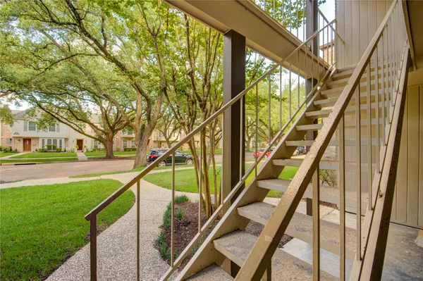 a view of an and deck with trees