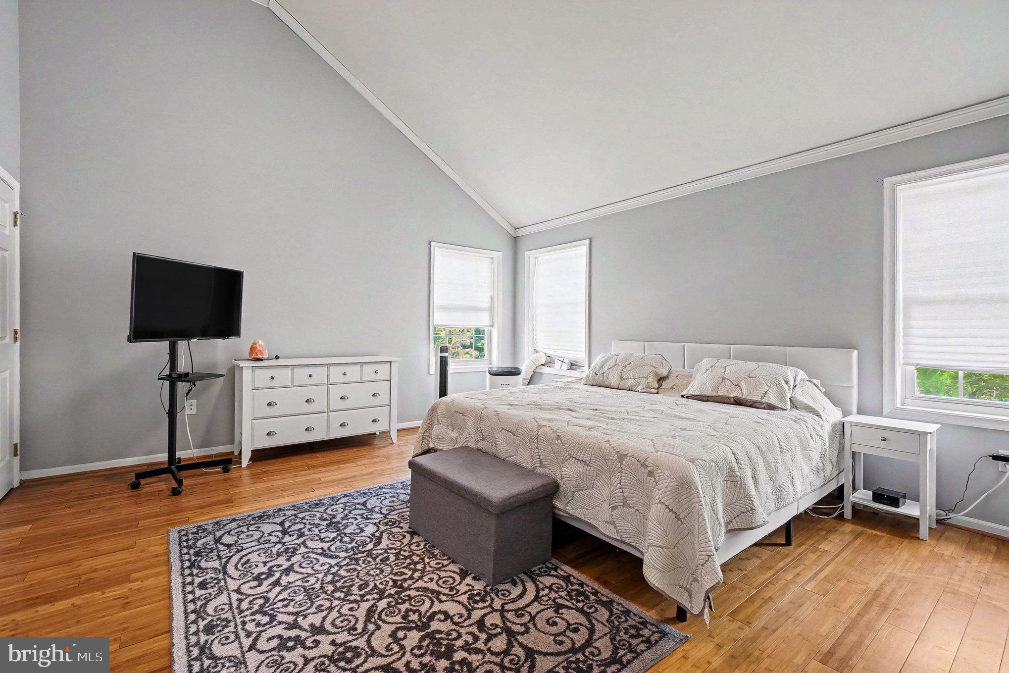 64 Open Meadow Court Elkton, MD 21921 - Photo 29 of 57 a spacious bedroom with a bed and a flat screen tv