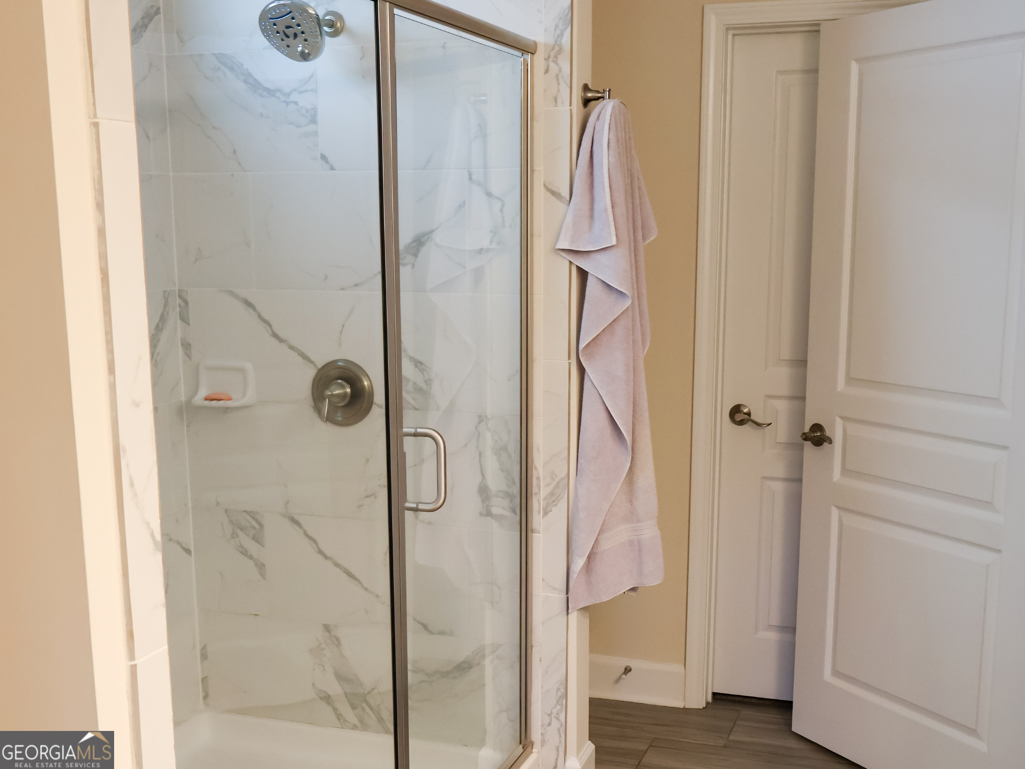 218 Florence Road Peachtree City, GA 30269 - Photo 27 of 47 a bathroom with a glass shower door and a sink