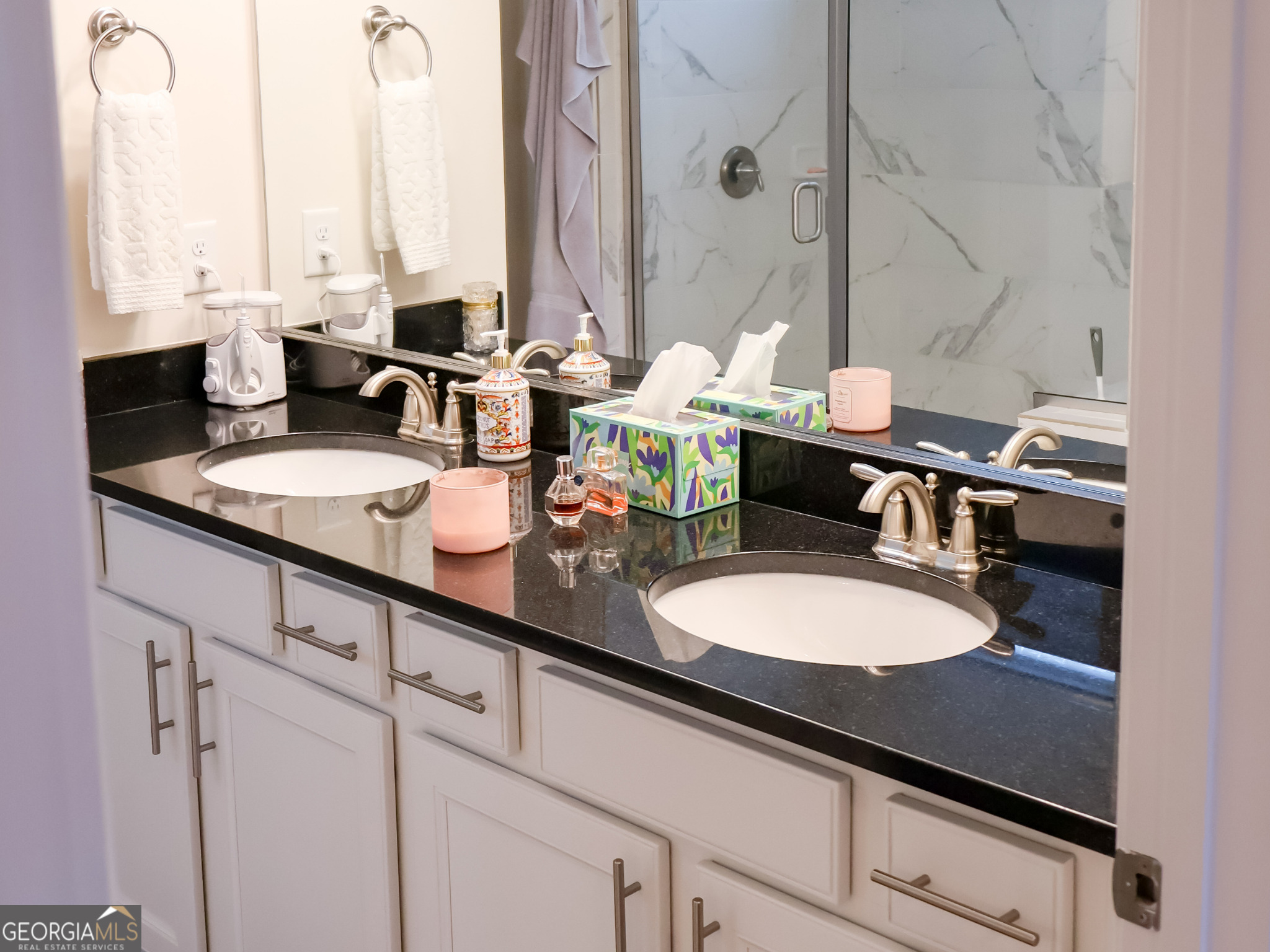 218 Florence Road Peachtree City, GA 30269 - Photo 28 of 47 a bathroom with double vanity sinks and a mirror