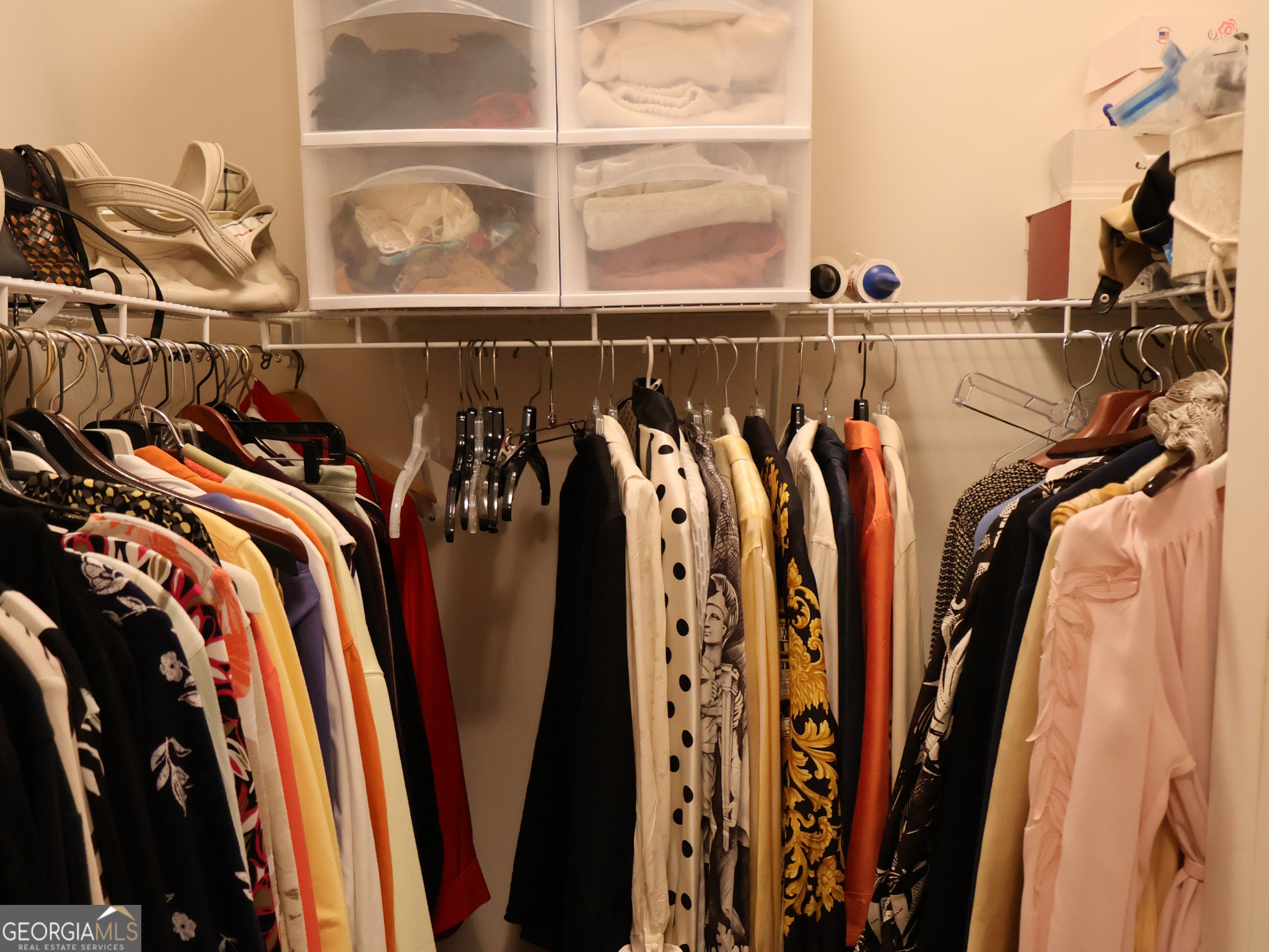 218 Florence Road Peachtree City, GA 30269 - Photo 30 of 47 a view of walk in closet with clothes and shoes