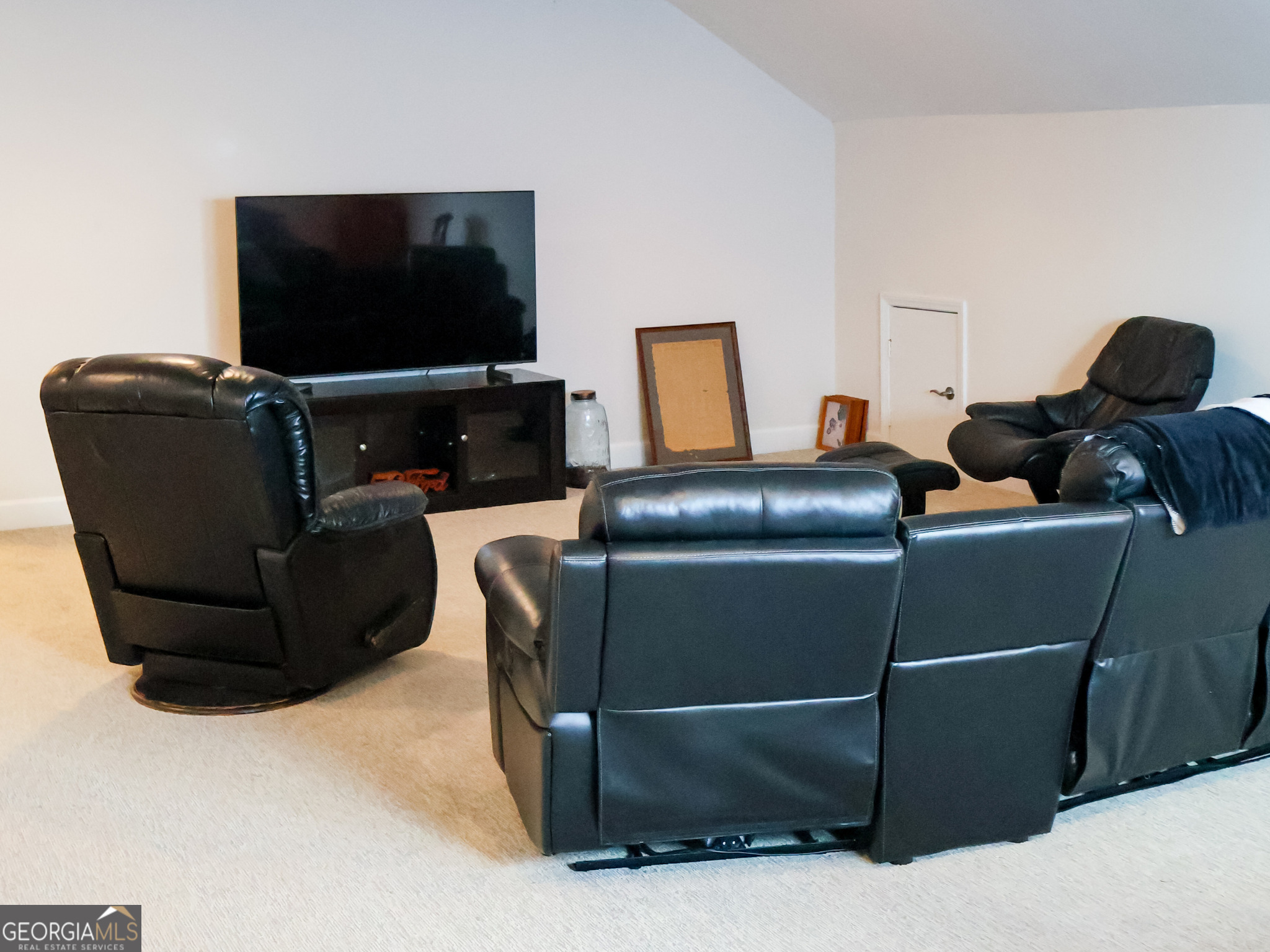 218 Florence Road Peachtree City, GA 30269 - Photo 34 of 47 a room with furniture and a flat screen tv