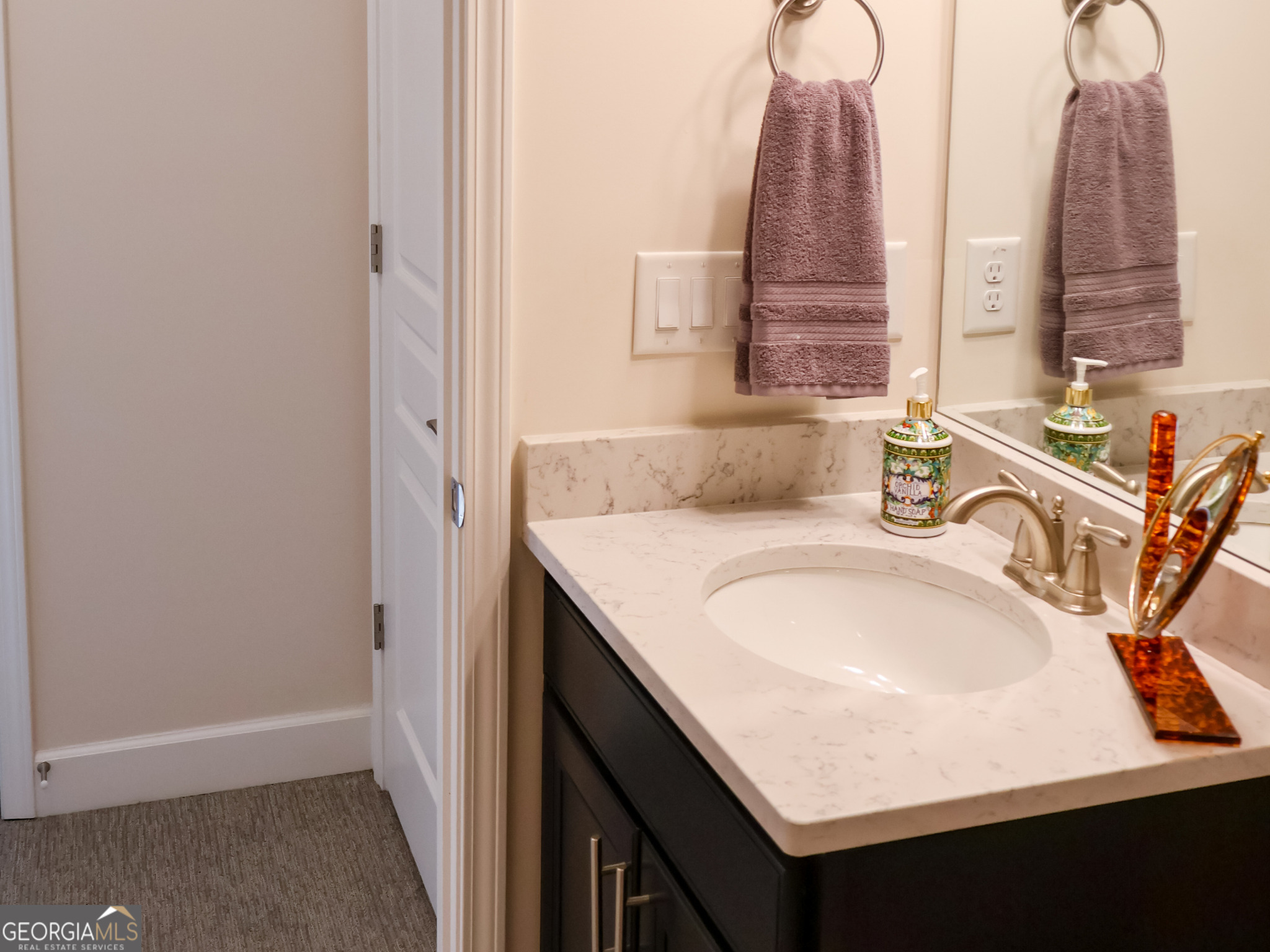218 Florence Road Peachtree City, GA 30269 - Photo 38 of 47 a bathroom with a sink vanity and a mirror
