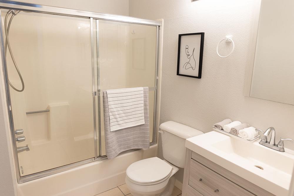 115 Rancho Drive, Unit B San Jose, CA 95111 - Photo 11 of 18 a white toilet sitting next to a bathroom sink