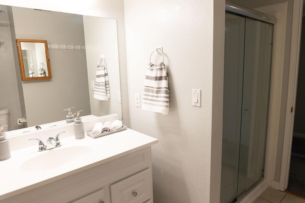 115 Rancho Drive, Unit B San Jose, CA 95111 - Photo 14 of 18 a bathroom with a sink and a mirror