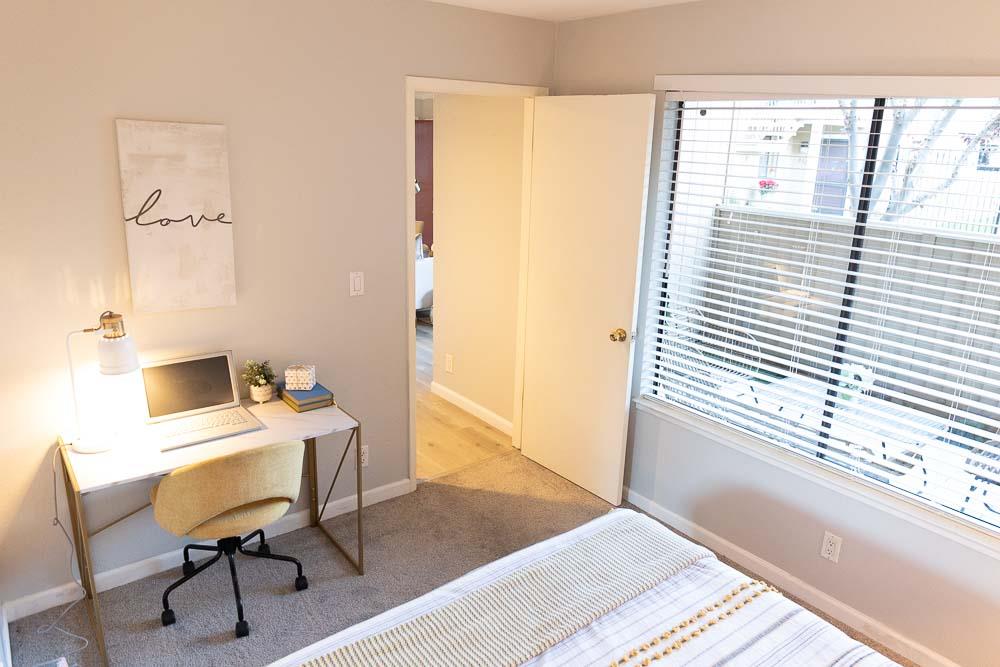 115 Rancho Drive, Unit B San Jose, CA 95111 - Photo 10 of 18 a view of a workspace with furniture and a window