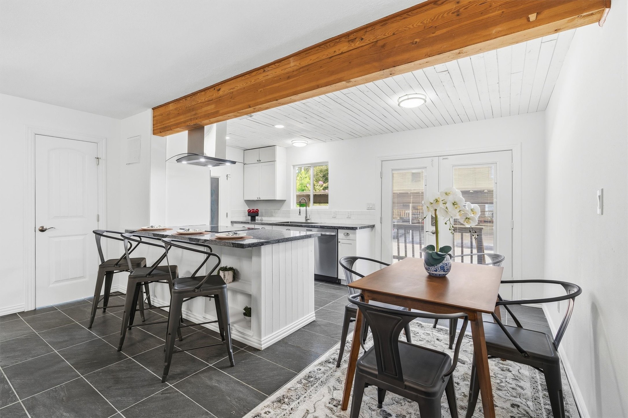 1011 Hamblen Road, Unit 306 Houston, TX 77339 - Photo 8 of 38 The kitchen opens right into a cozy dining nook, with a wood beam overhead tying the whole space together.