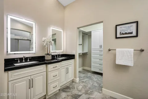 a bedroom with a bed and a view of bathroom