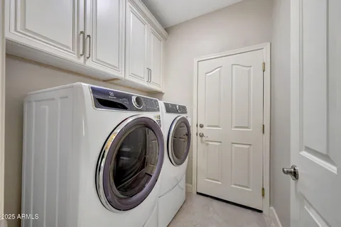 a living room with a window and a table
