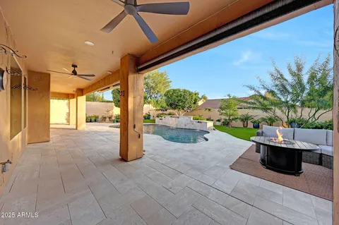 a view of a patio with table and chairs potted plants with wooden floor