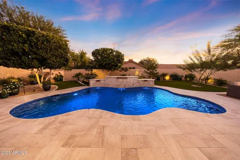 a view of a swimming pool with lounge chair