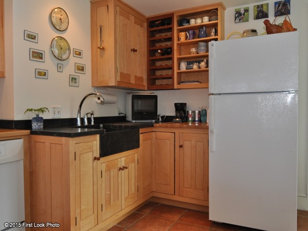 31 Old Farm Road Little Compton, RI 02837 - Photo 8 of 30 a kitchen with stainless steel appliances granite countertop a refrigerator and a stove