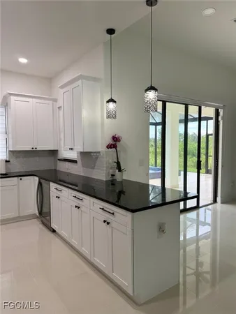 a large kitchen with cabinets