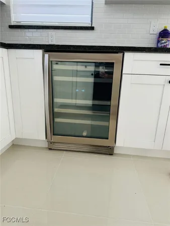 a stove top oven sitting inside of a kitchen