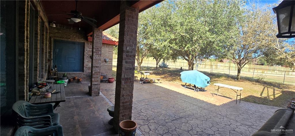 5312 Mile 4 Road Mission, TX 78573 - Photo 12 of 13 Fenced backyard featuring a patio area and ceiling fan